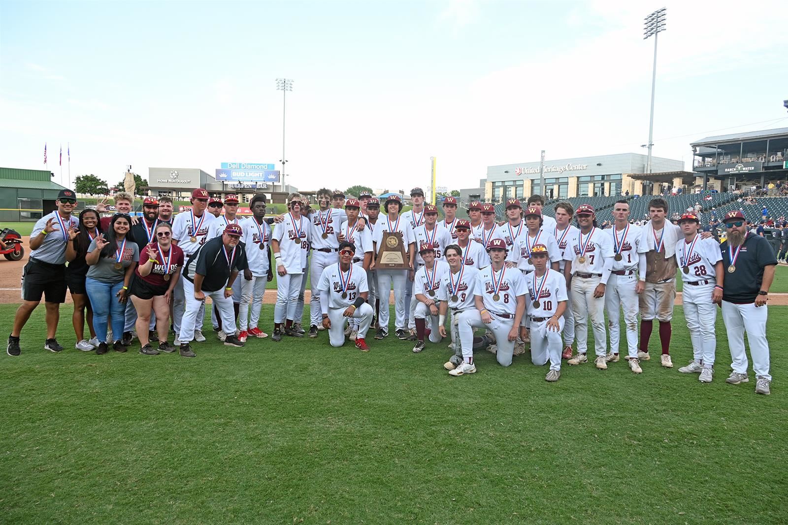The Cypress Woods High School baseball team poses for photos following its Class 6A state semifinal game.